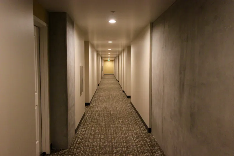 Hallway with recessed lighting and carpet in the Smart Corner community