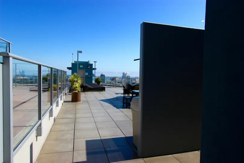 A sunny day in the area of Smart Corner, outside, potted plants. rooftop, skyline