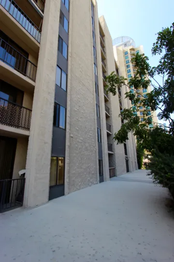 Tall brown building with clear blue skies at Symphony Terrace in Downtown San Diego, California
