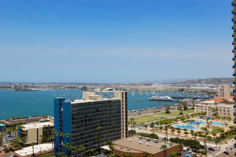 The Grande is San Diego, CA, overlooking the bay with a cruise ship.