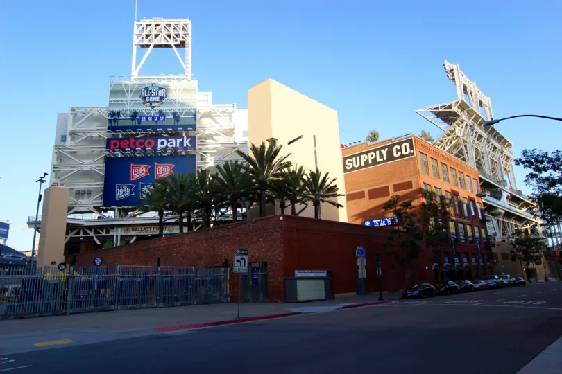 Business street of The Legend with cars, buildings, and big billboards