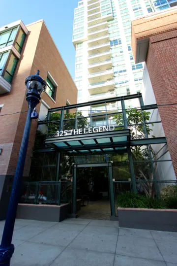 A sunny day in the area of The Legend, outside, lightpost, high rise, tree, sky, window