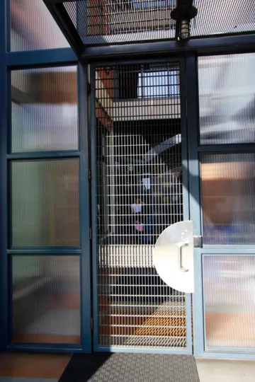 Iron mess doors with safety and closed view of a building in The Lofts @777 Sixth.