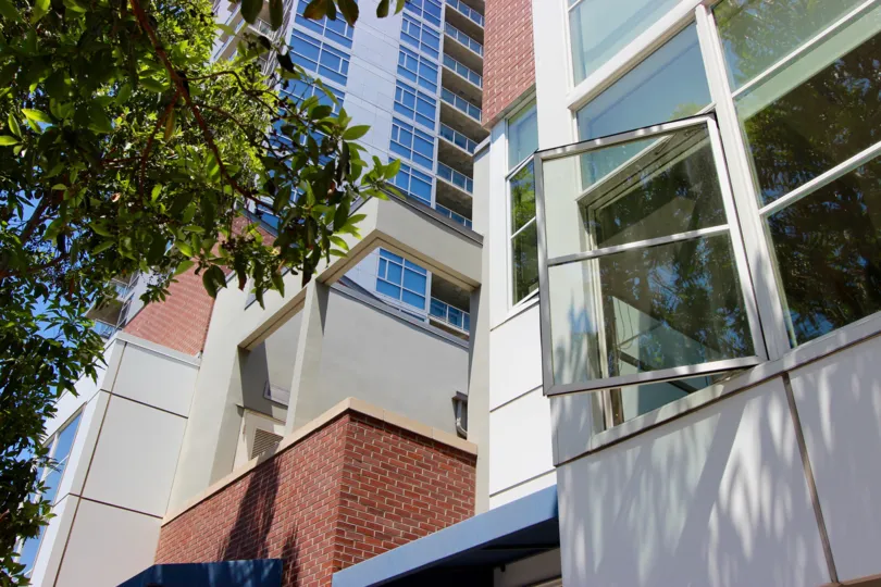 An open window overlooking a tree at The Mark in downtown San Diego, CA