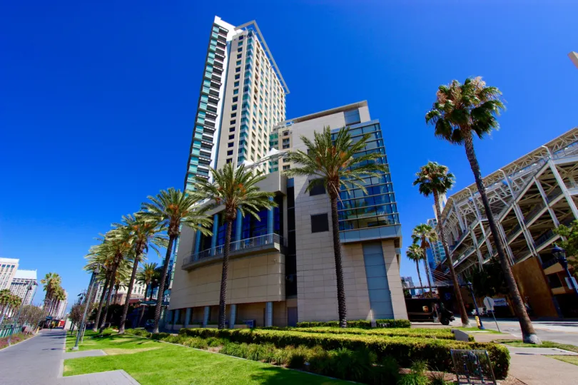 A parking garage sits behind The Metropolitan condo building