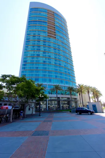 The Multistory buildings in the The Metropolitan with beautiful colors and parking Cars