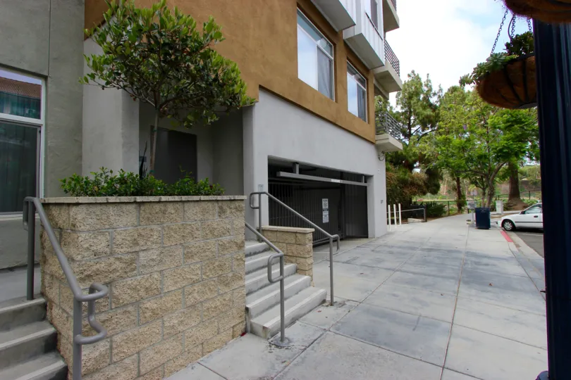 A plain sidewalk near a building in The Mills at Cortez Hill neighborhood
