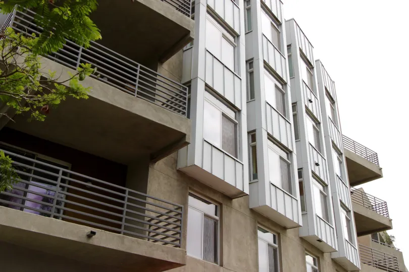 Broad balcony with front elevation and glass doors in The Mills at Cortez HIll.