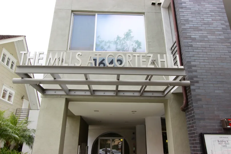A sunny day in the area of The Mills at Cortez Hill, entrance, window, welcome sign