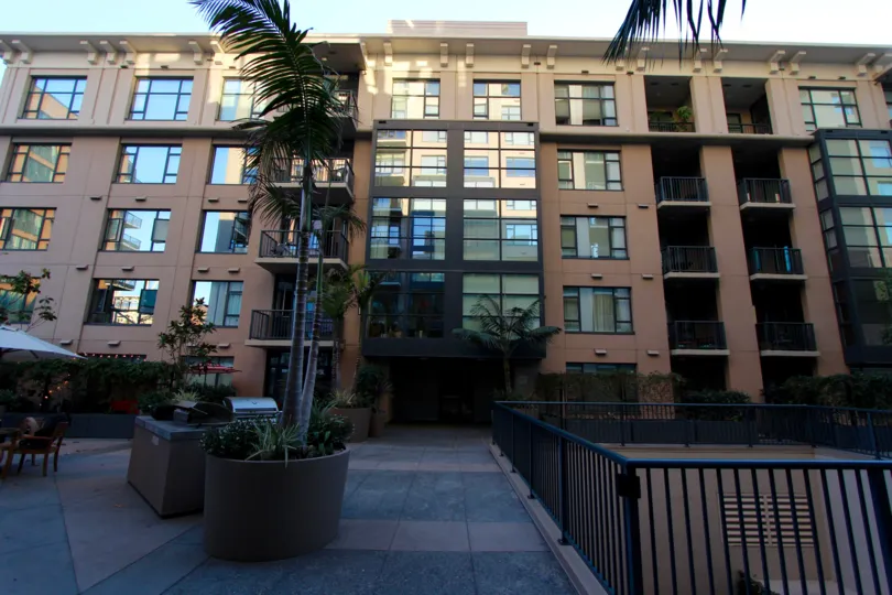 awesome front view with trees and plants in front of building in Trellis