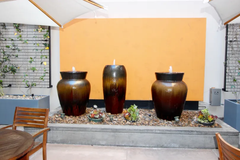 three decorative candle in the sitting area of restaurant in Trellis Downtown San Diego CA