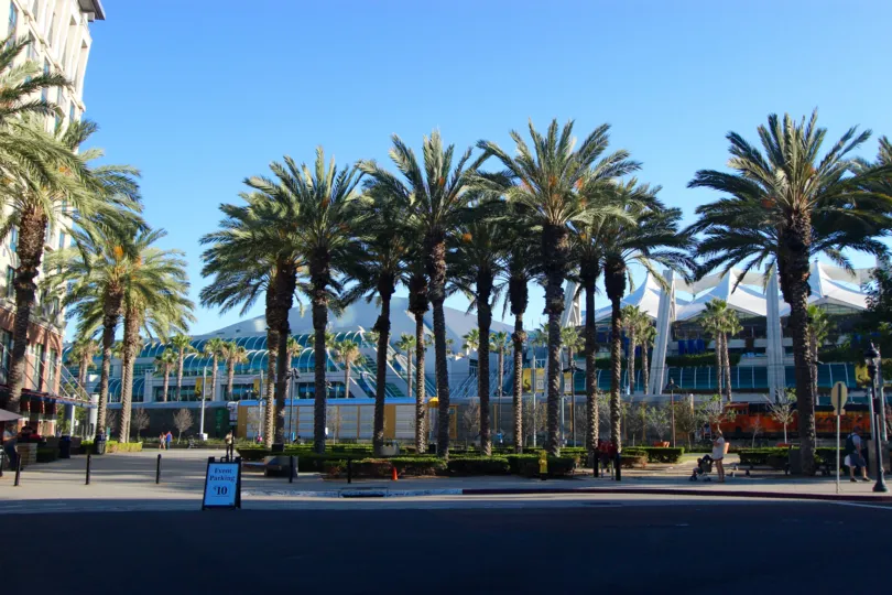 A sunny day in the area of Union Square, outd=side, palm trees, street, sidewalk, parking sign