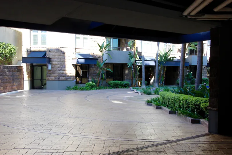Ground floor view of a building with shrubs in Union Square.