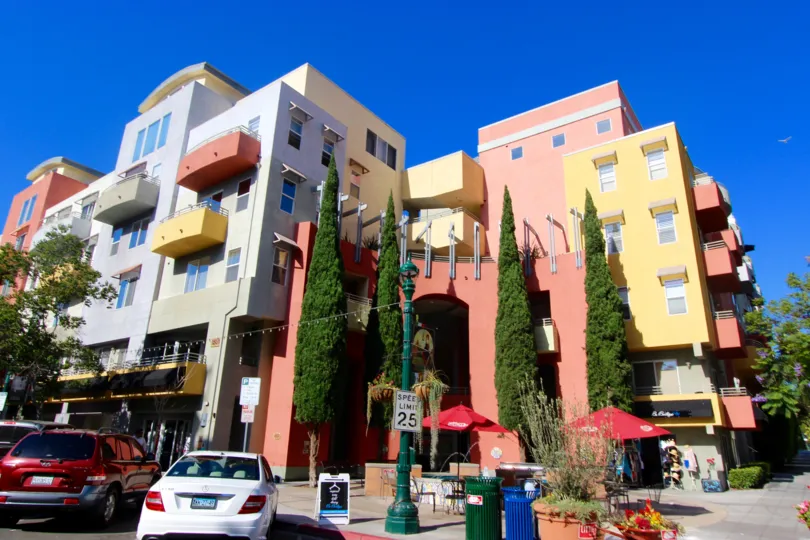A sunny day in Downtown San Diego California. An apartment building with shops in the Village Walk Community