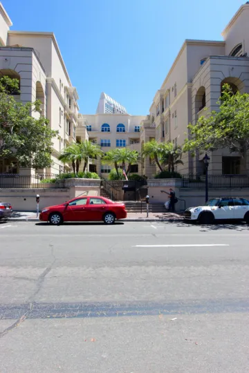 Cars parked on the street in front of Watermark in downtown San Diego, CA