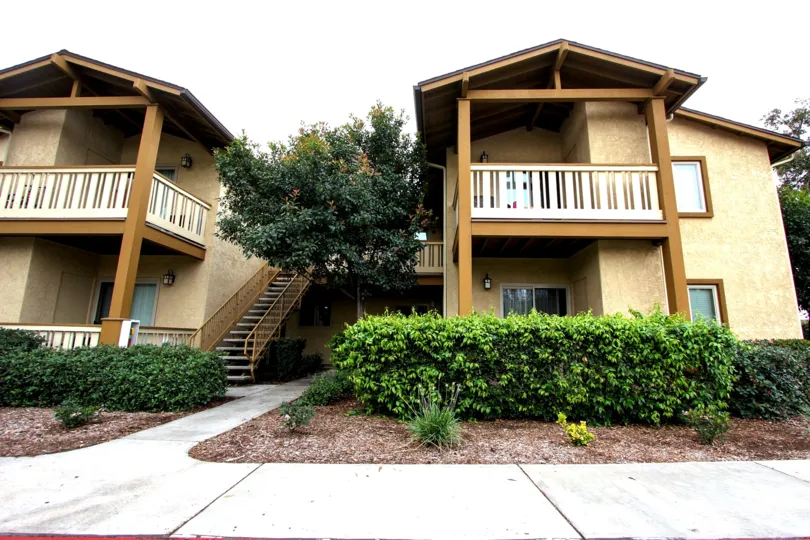 A landscaped building in the Alder Woods housing community