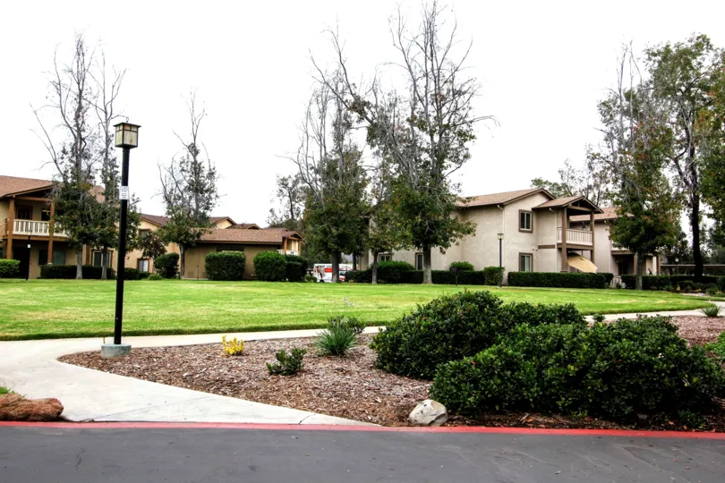 VERY BEAUTIFUL HOUSE. IN FRONT OF IT THERE IS A LAWN. GREENERY IS EVERY WHERE.