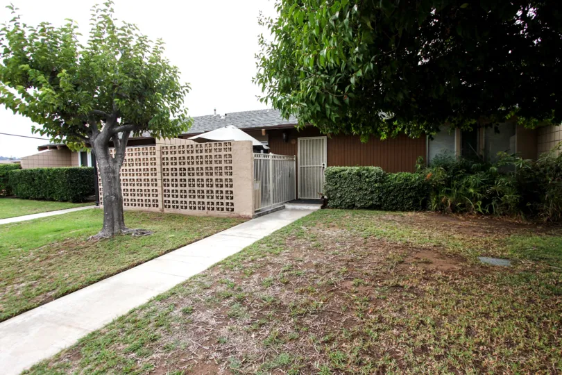 VERY BEAUTIFUL HOUSE. IN FRONT OF IT THERE IS A LAWN. GREENERY IS EVERY WHERE.