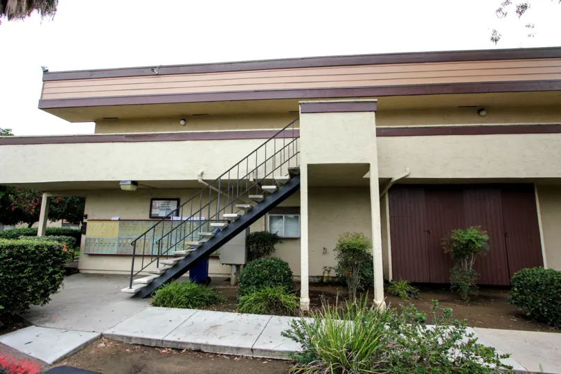 A staircase and mailboxes in front of the Bradley Condos apartment complex in El Cajon, California.