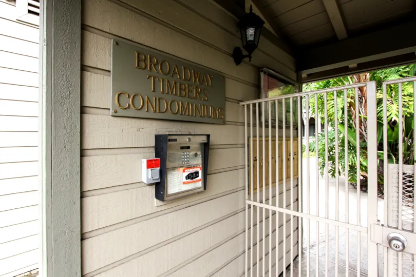 A close up shot of the front office intercom and gate of the Broadway Timbers in El Cajon, California.