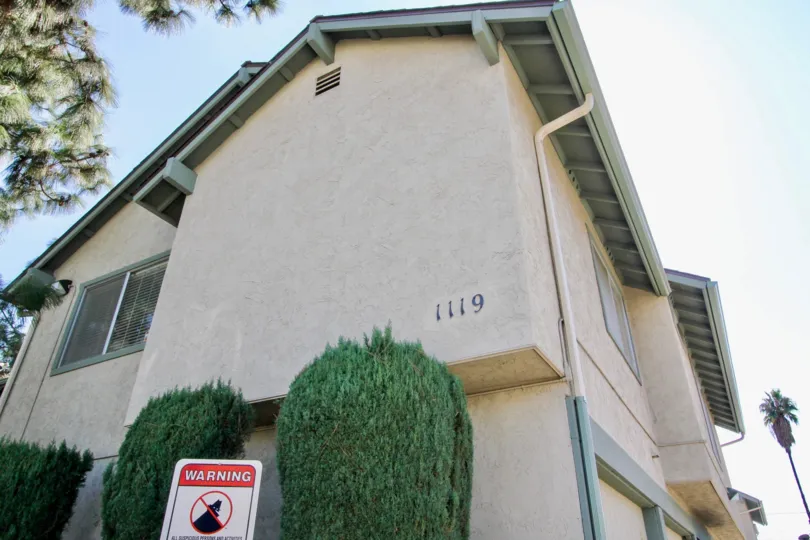 Two story residential building with trees at Centaur Villas in El Cajon California