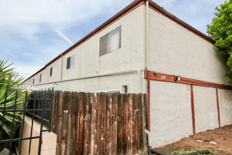 Two story residence with wooden fence at Cherrywood Park in El Cajon California