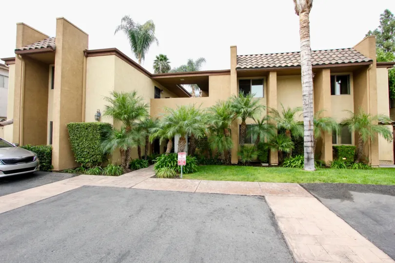 A BEAUTIFUL BIG VILLA AND A NICE CAR AND IT LOOK LIKE A HUGE ONE FOR SO MANY PERSONS