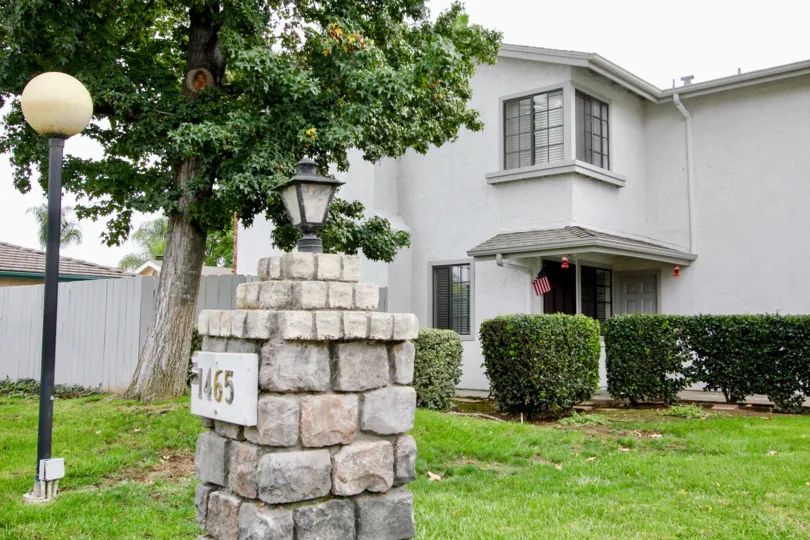 VERY BEAUTIFUL HOUSE. IN FRONT OF IT THERE IS A LAWN. GREENERY IS EVERY WHERE.
