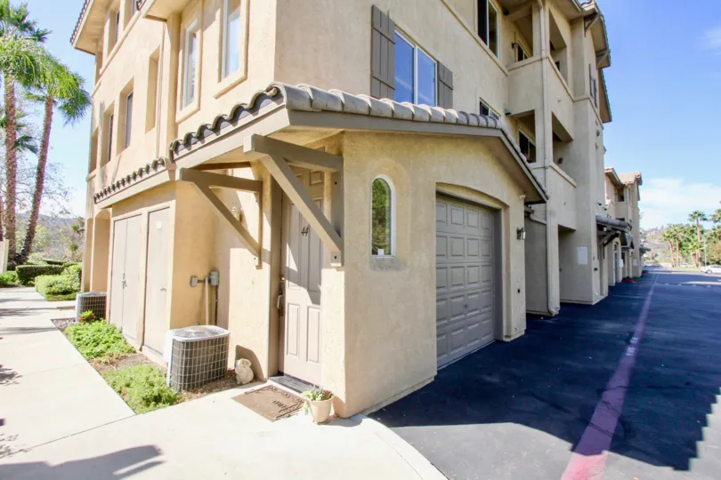 an apartment building in Fairway Villas with garage and entryways