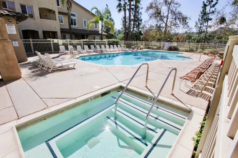Swimming pool and lounge area of Fairwa Villas, a residential community located in El Cajon, CA