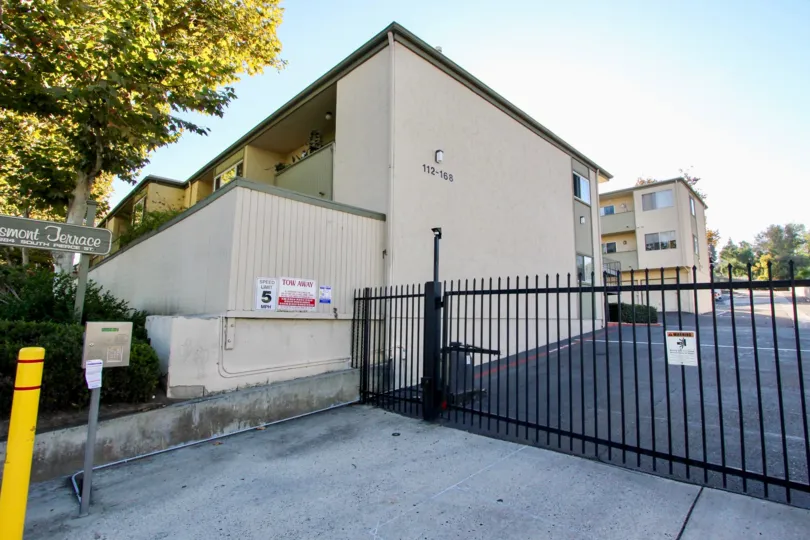 Entry gate into Grossmont Terrace with view of apartment building.