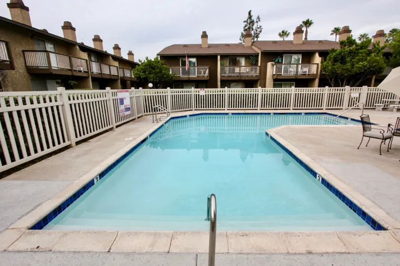 An apartment complex with a swimming pool on an overcast day in Heritage Grove, a neighborhood in El Cajon, California