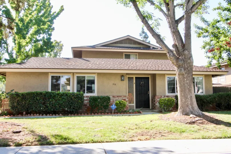 VERY BEAUTIFUL HOUSE. IN FRONT OF IT THERE IS A LAWN. GREENERY IS EVERY WHERE.