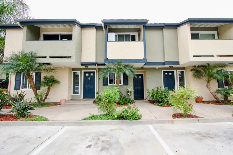 The Magnolia Park Townhomes looks very wide with beautiful plants in the front side