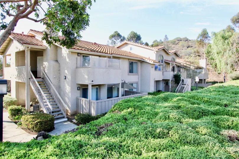 VERY BEAUTIFUL HOUSE. IN FRONT OF IT THERE IS A LAWN. GREENERY IS EVERY WHERE.