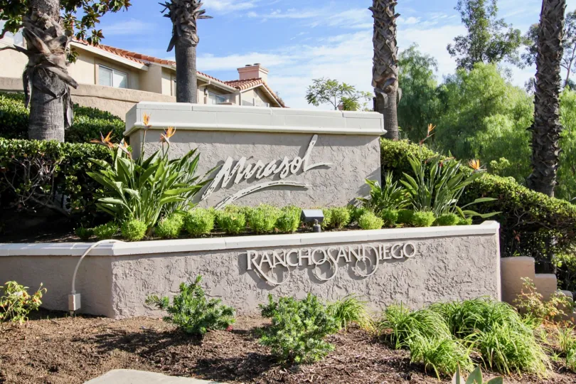 Metal sign on gray cement wall at Mirasol in El Cajon CA