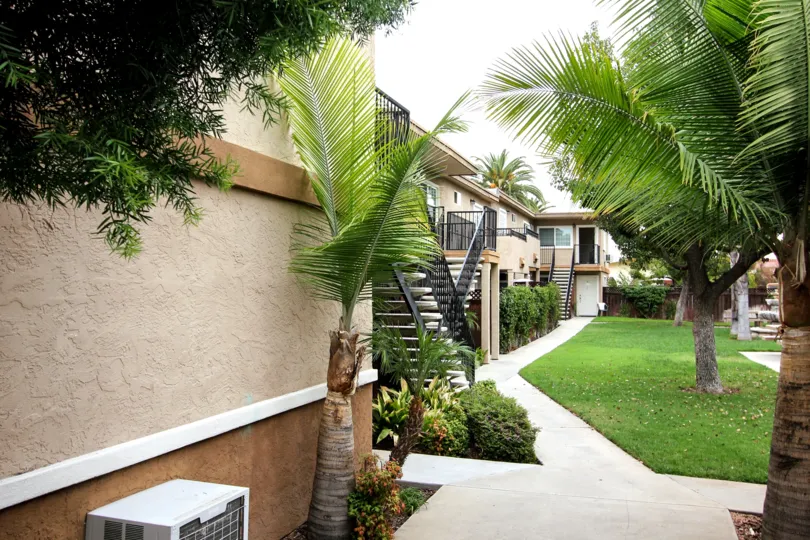 VERY BEAUTIFUL HOUSE. IN FRONT OF IT THERE IS A LAWN. GREENERY IS EVERY WHERE.
