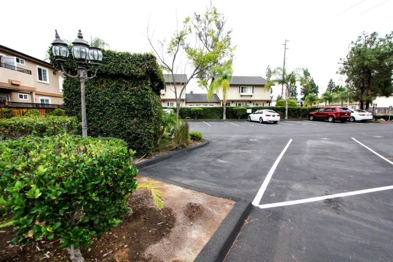 Parking lot near residential buildings at Mollison Villas II in El Cajon California