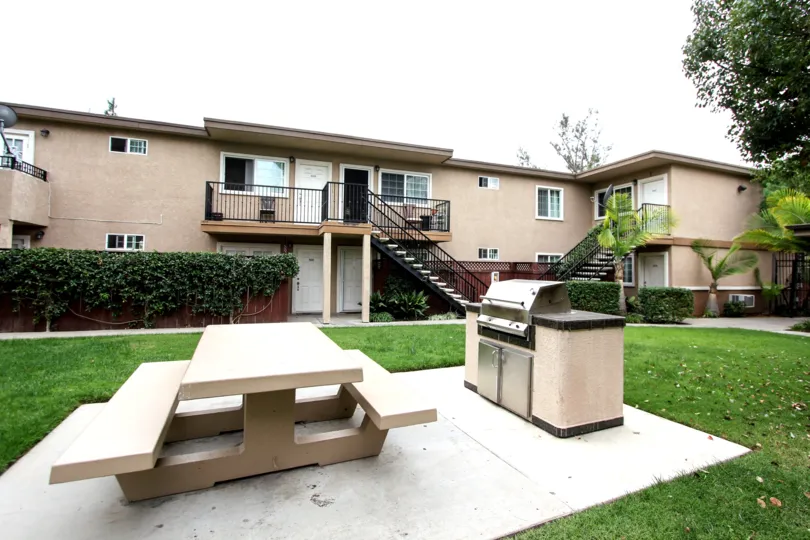 Picnic bench and barbeque at housing community Mollison Villas II in El Cajon, California