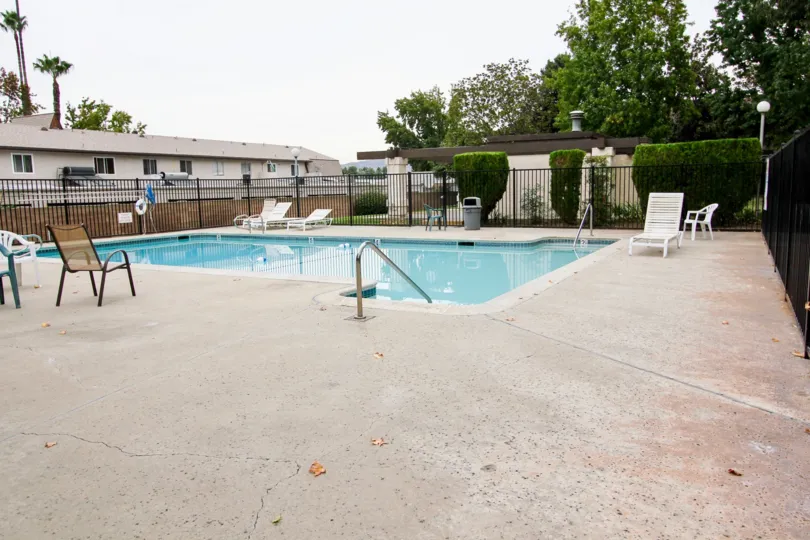 A BEAUTIFUL SWIMMING POOL WITH FULL OF WATER IN A VILLA