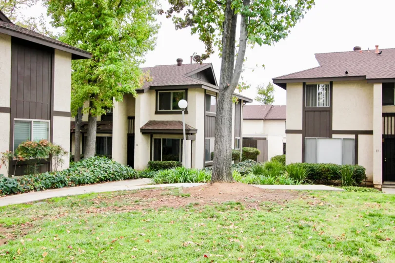 VERY BEAUTIFUL HOUSE. IN FRONT OF IT THERE IS A LAWN. GREENERY IS EVERY WHERE.