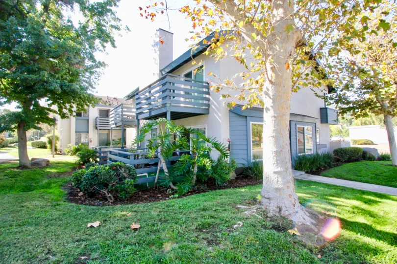 VERY BEAUTIFUL HOUSE. IN FRONT OF IT THERE IS A LAWN. GREENERY IS EVERY WHERE.