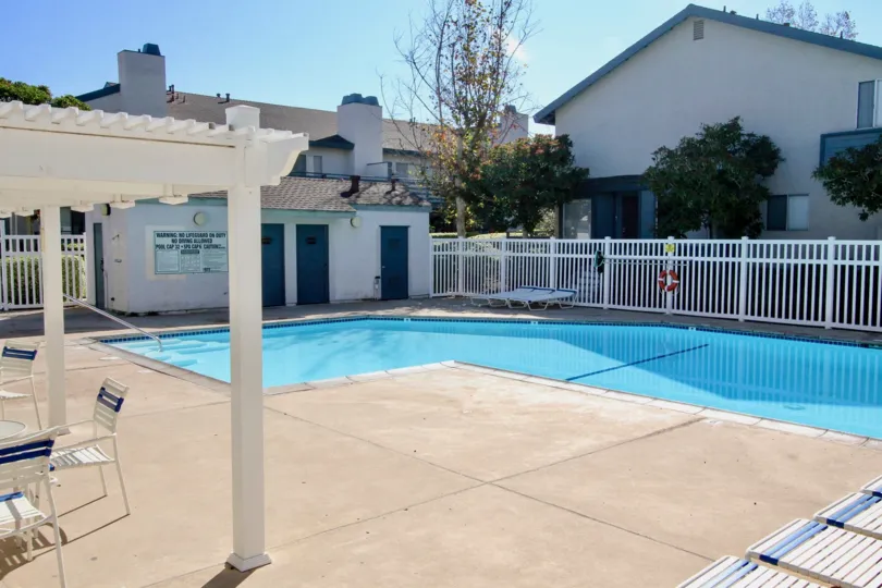 A pool with the sun shining down in the community Mountain View Village.