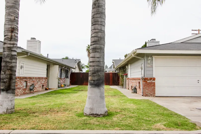 VERY BEAUTIFUL HOUSE. IN FRONT OF IT THERE IS A LAWN. GREENERY IS EVERY WHERE.