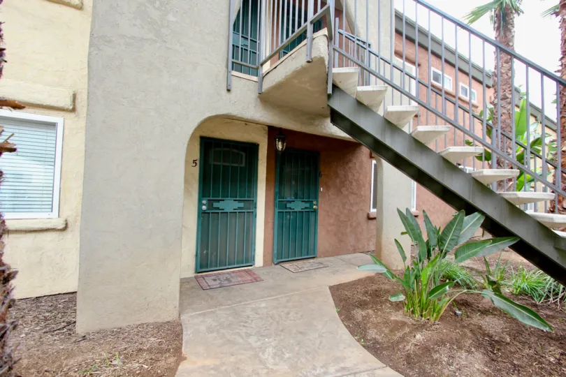 Two doors under a staircase at the Oasis Palms housing community