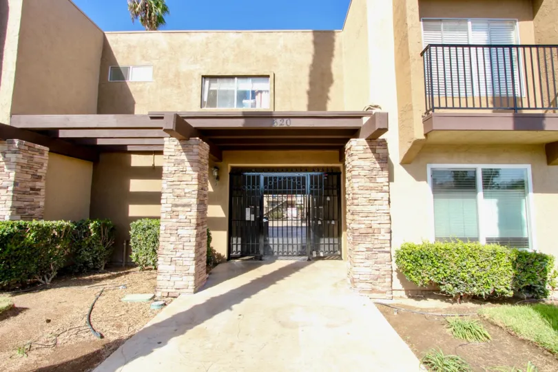 black gate 3 pillers home num 620 bolgany grees trees windows screens road pipe light sky