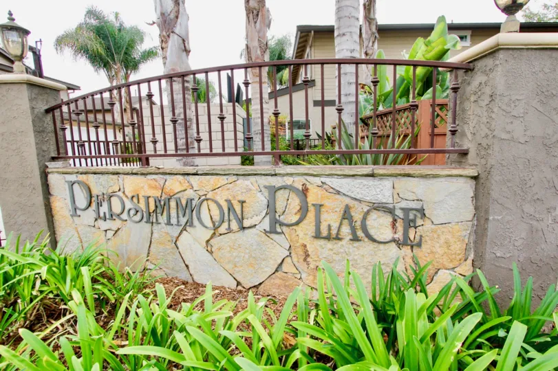 The sign at the entrance of the Persimmon Place housing community