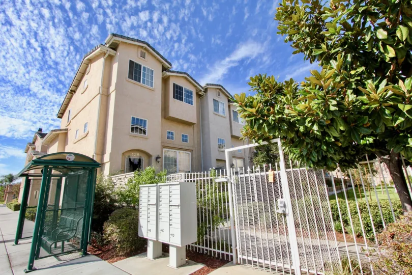 White fence surrounded town homes at Promenade Square in El Cajon California