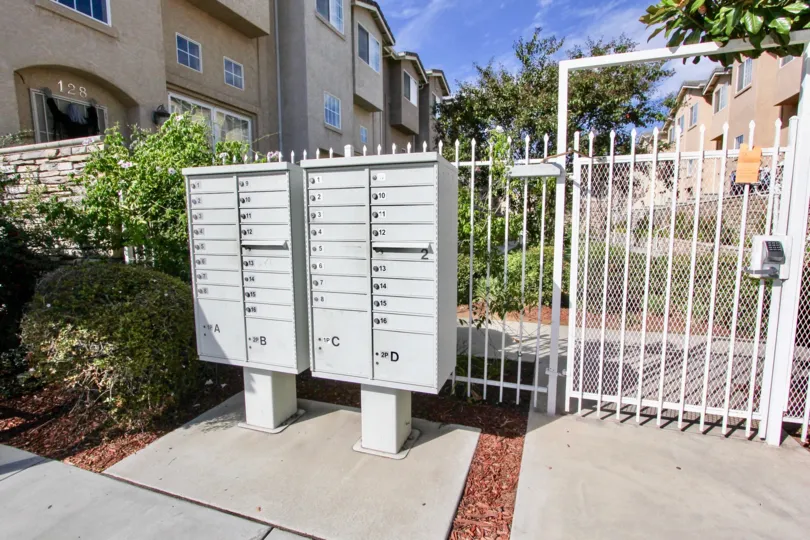 Resident mailboxes and security gate at Promenade Square.