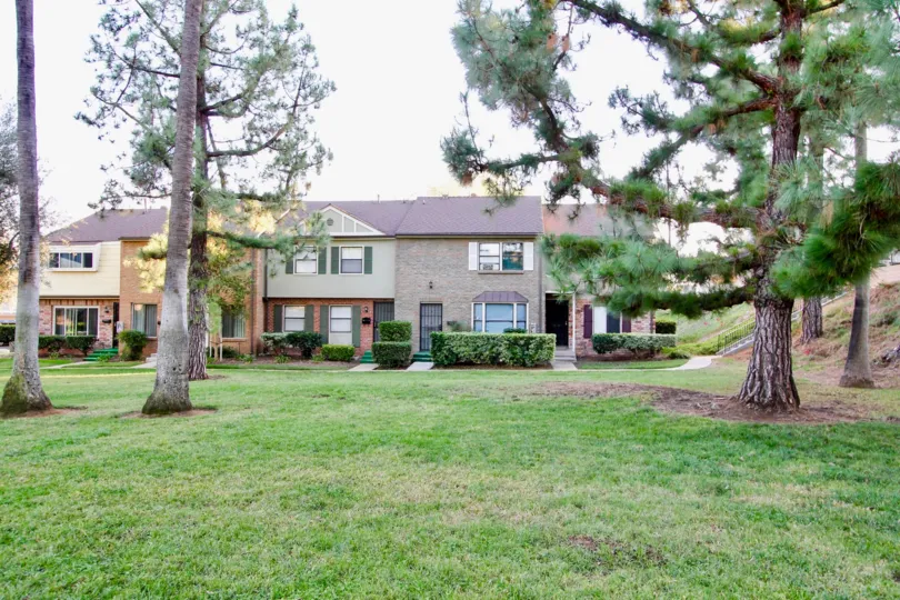 VERY BEAUTIFUL HOUSE. IN FRONT OF IT THERE IS A LAWN. GREENERY IS EVERY WHERE.